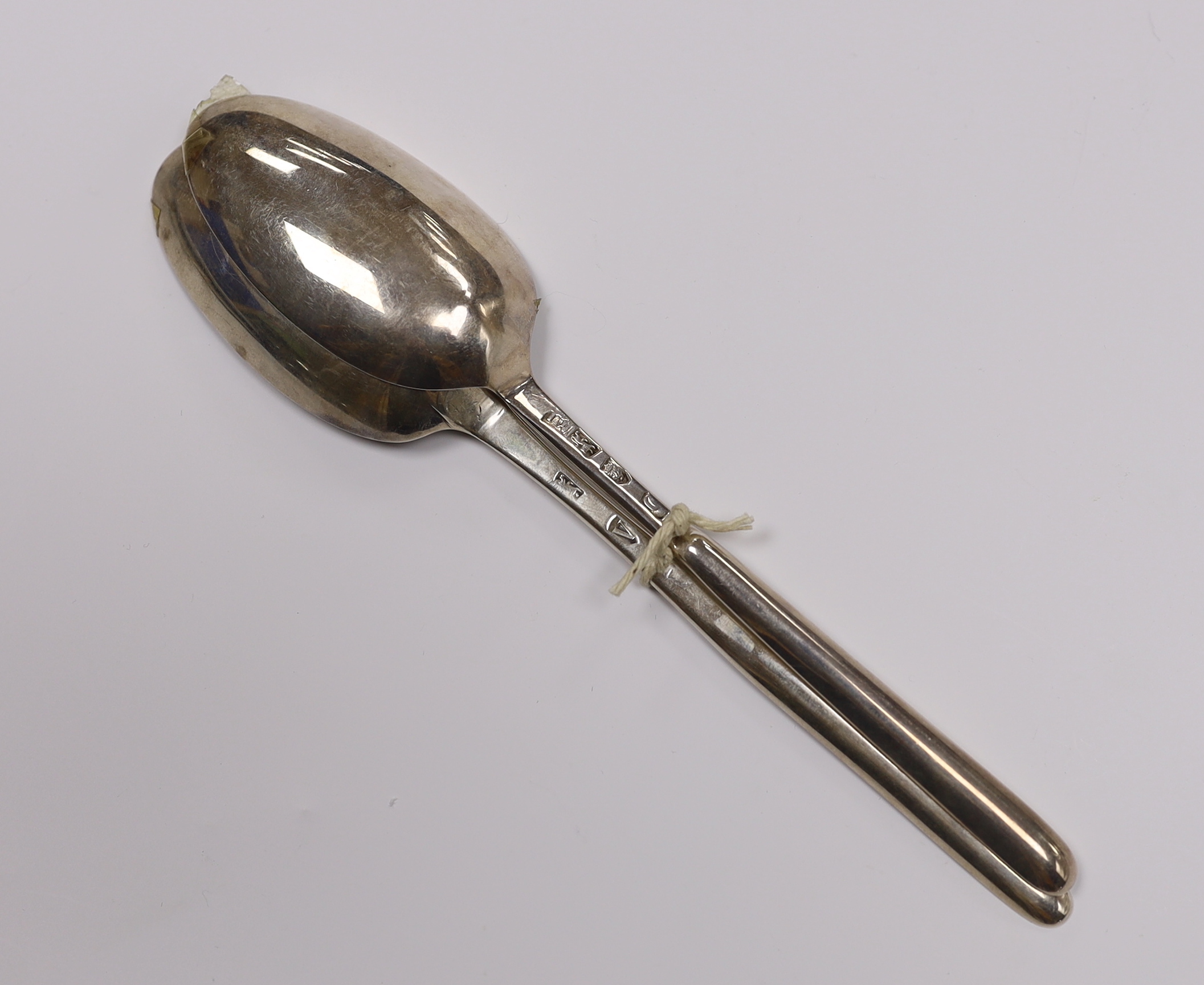 Two 18th century silver combination marrow scoop spoons, London, 1735 and James Wilks, London, 1729?, longest 21.2cm, 97 grams.